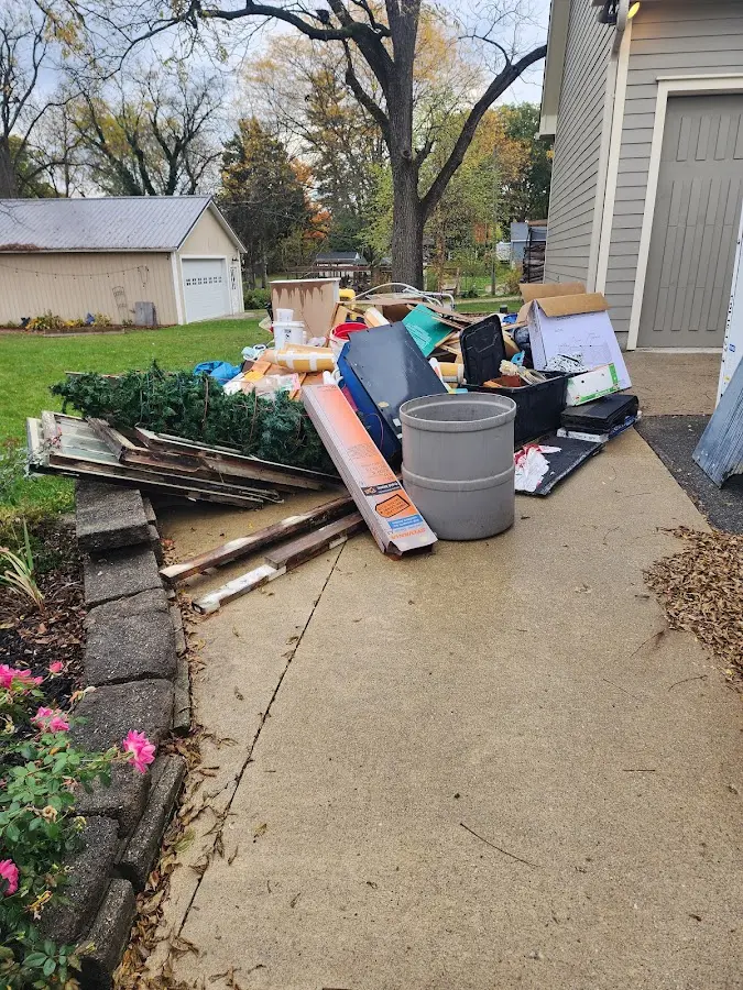 Dumpster being loaded with debris for Estate Cleanout Dumpster Rental in Jan Phyl Village